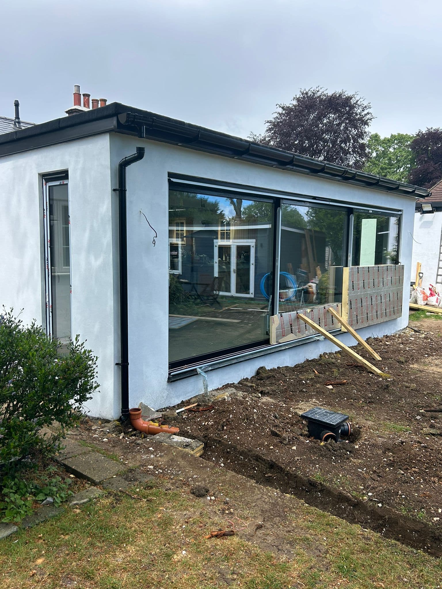 6m aluminium sliding door installation from garden — The Gallop Sutton